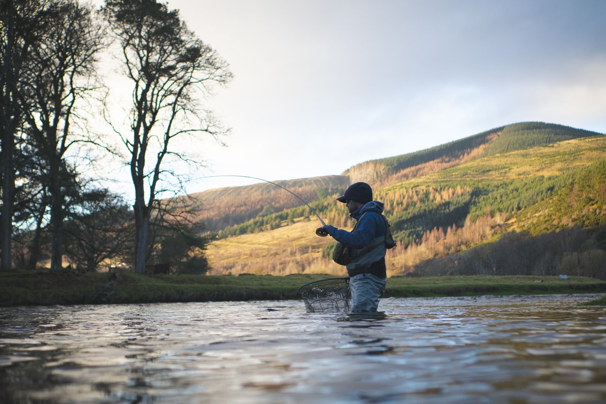 Scott coaching on the river at golden hour