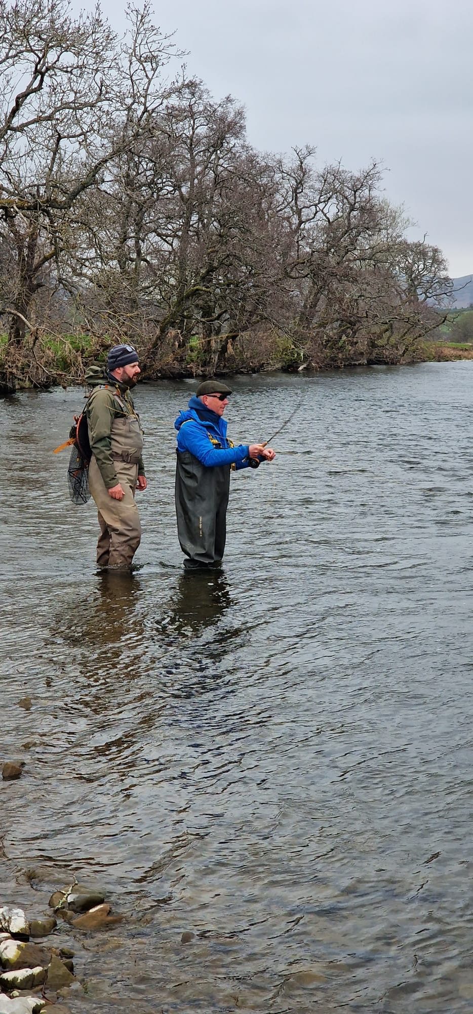 Scott Hamilton coaching a client casting on a Scottish river
