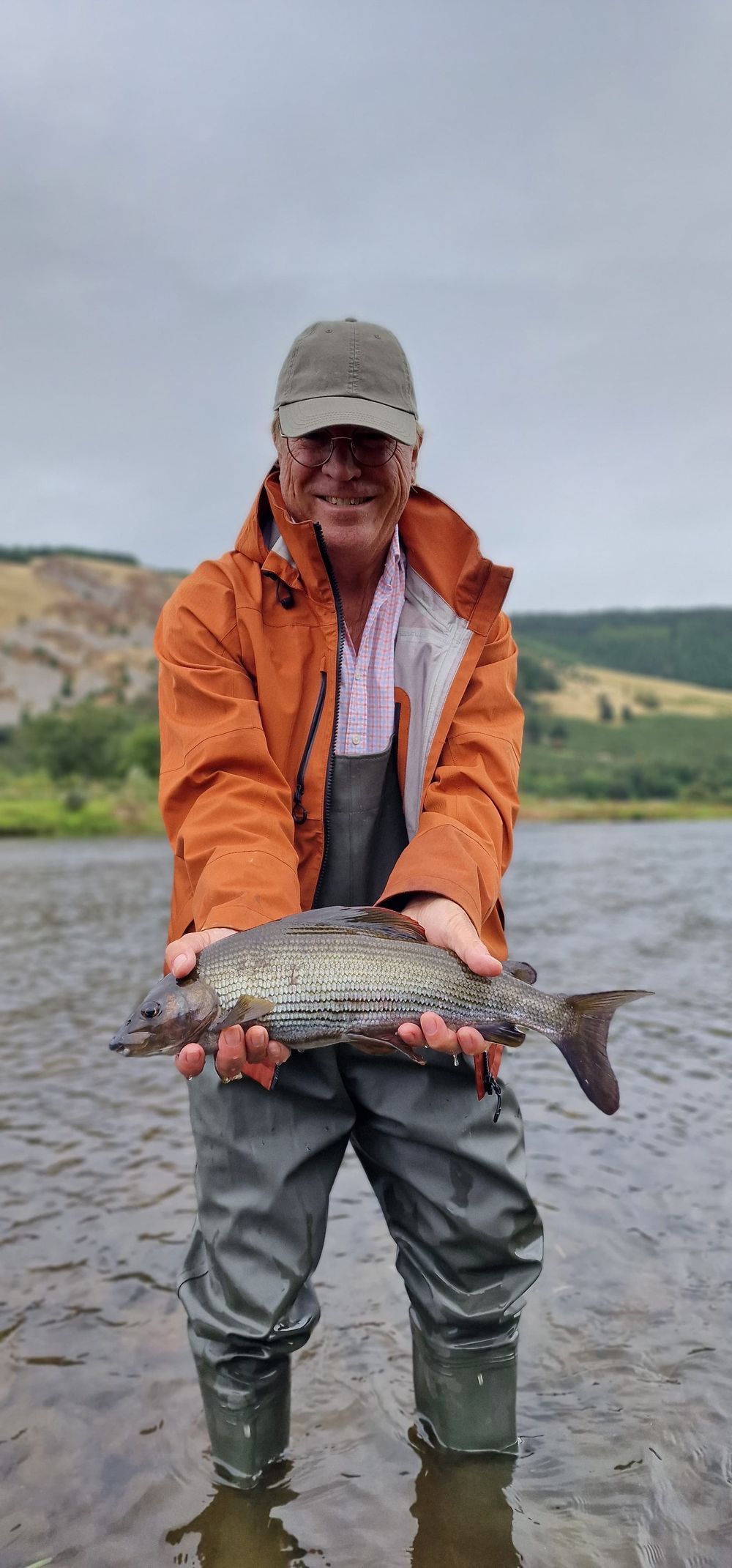 Client with a specimen grayling on a Scottish river